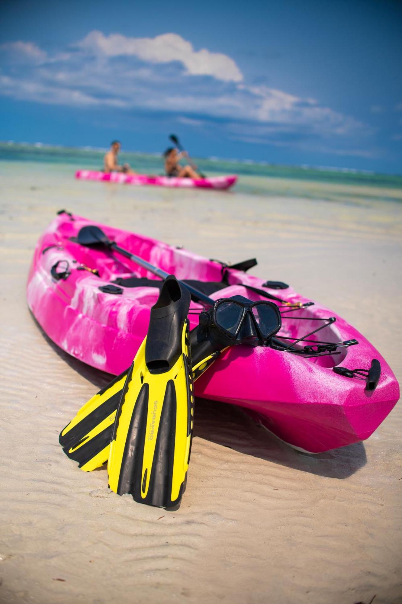Diamonds Leisure Beach & Golf Resort Diani Beach Esterno foto A sit-on-top kayak with a pair of flippers