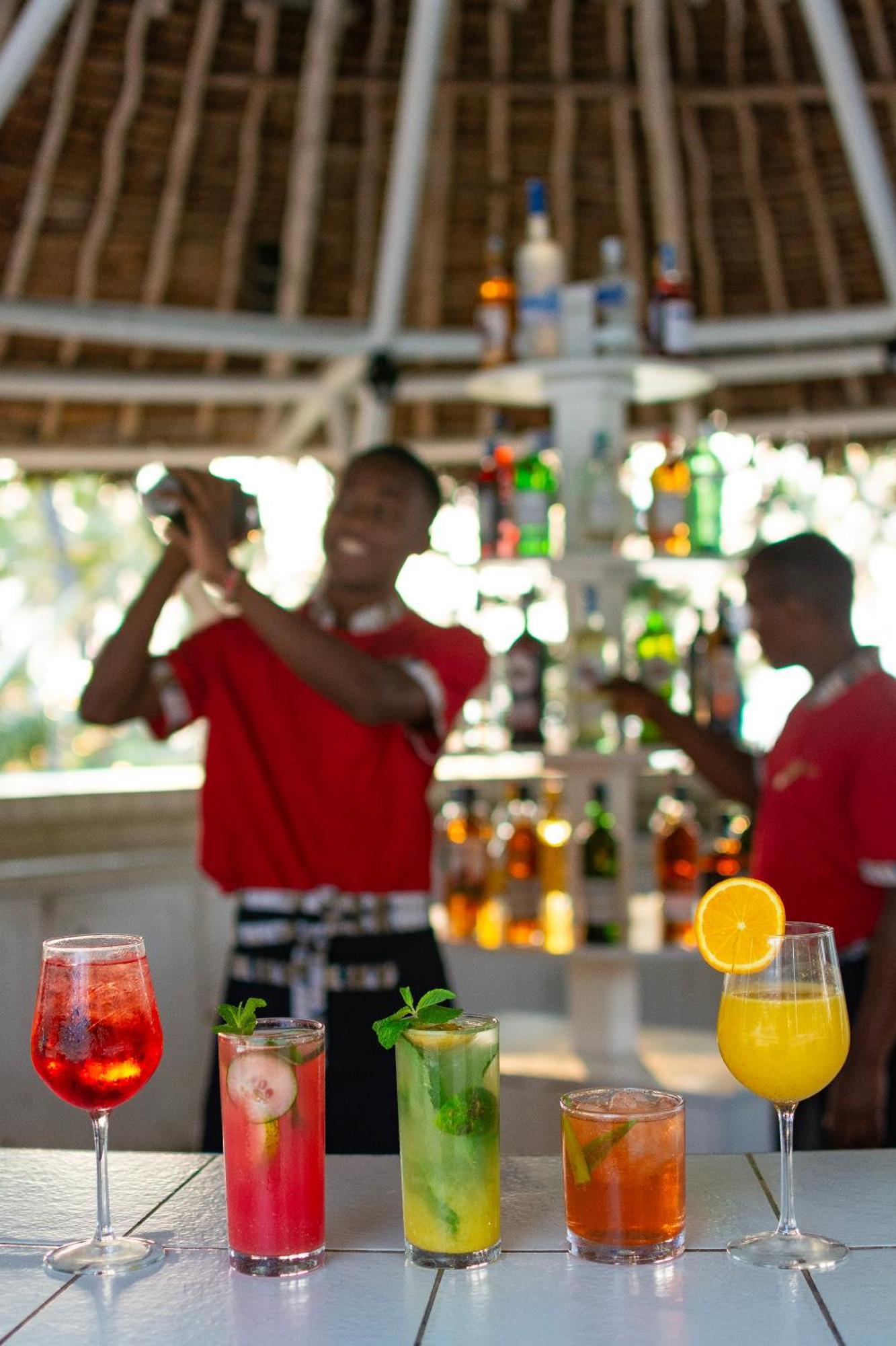 Diamonds Leisure Beach & Golf Resort Diani Beach Esterno foto Bartenders at work