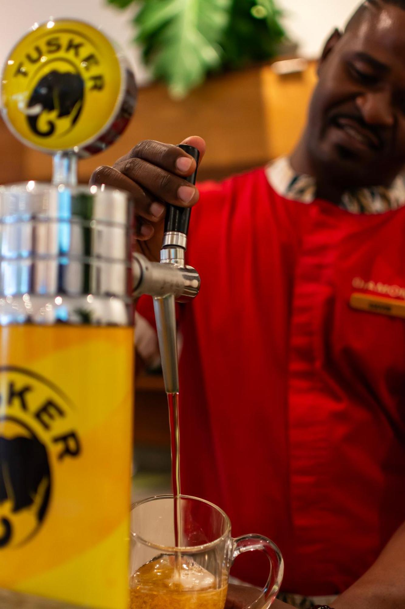 Diamonds Leisure Beach & Golf Resort Diani Beach Esterno foto A beer tap
